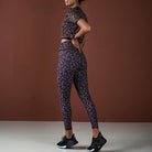 Person wearing a patterned athletic outfit on a brown background